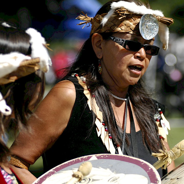 Two women participating in a drum circle
