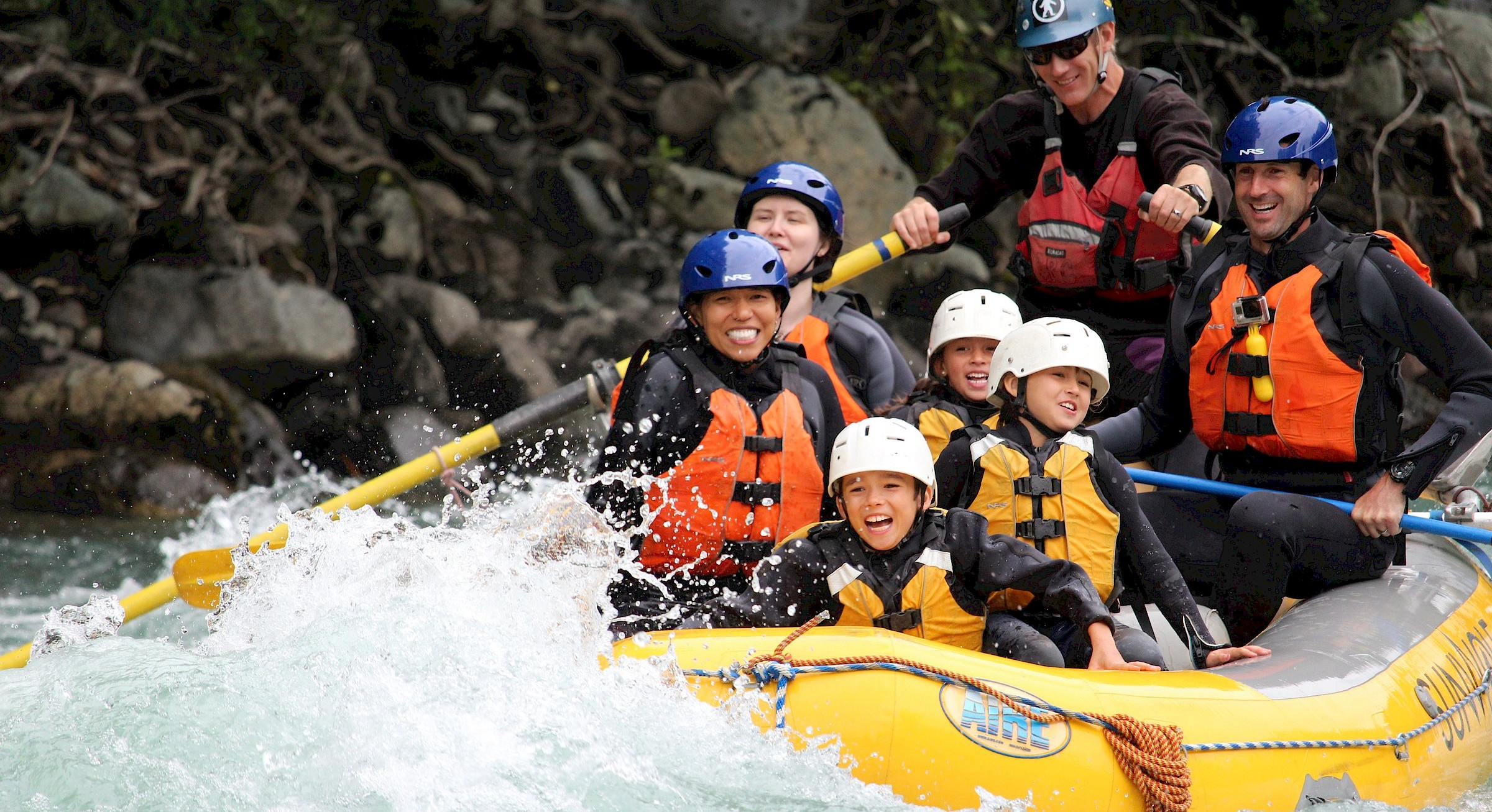 Family enjoying a whitewater rafting trip