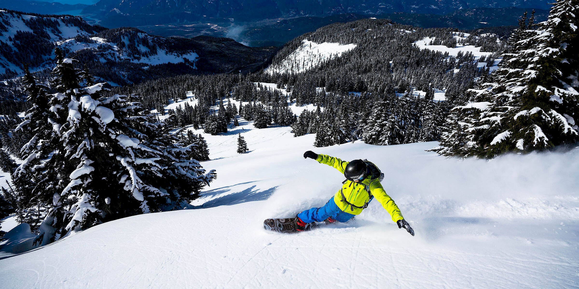 Snowboarder making powder turns