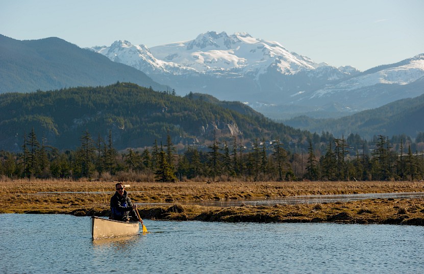 A person canoeing in the Squamish Estuary