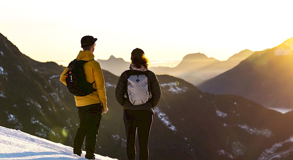 Couple enjoying the view after snowy hike