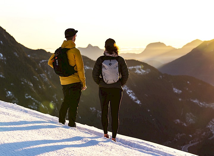Couple enjoying the view after snowy hike