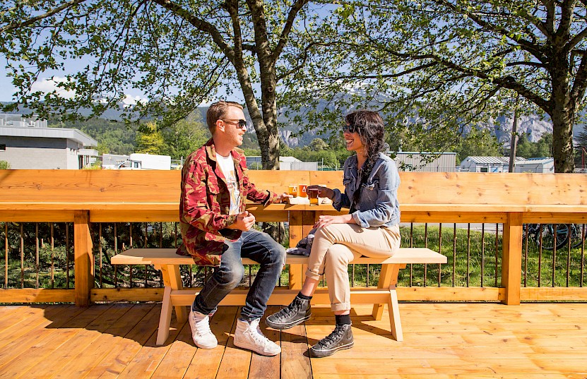 Couple enjoying beer on the A-Frame Brewery patio