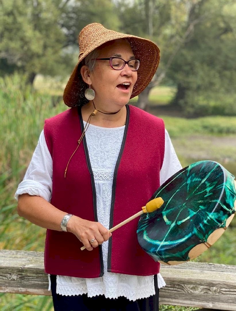 Woman with drum singing