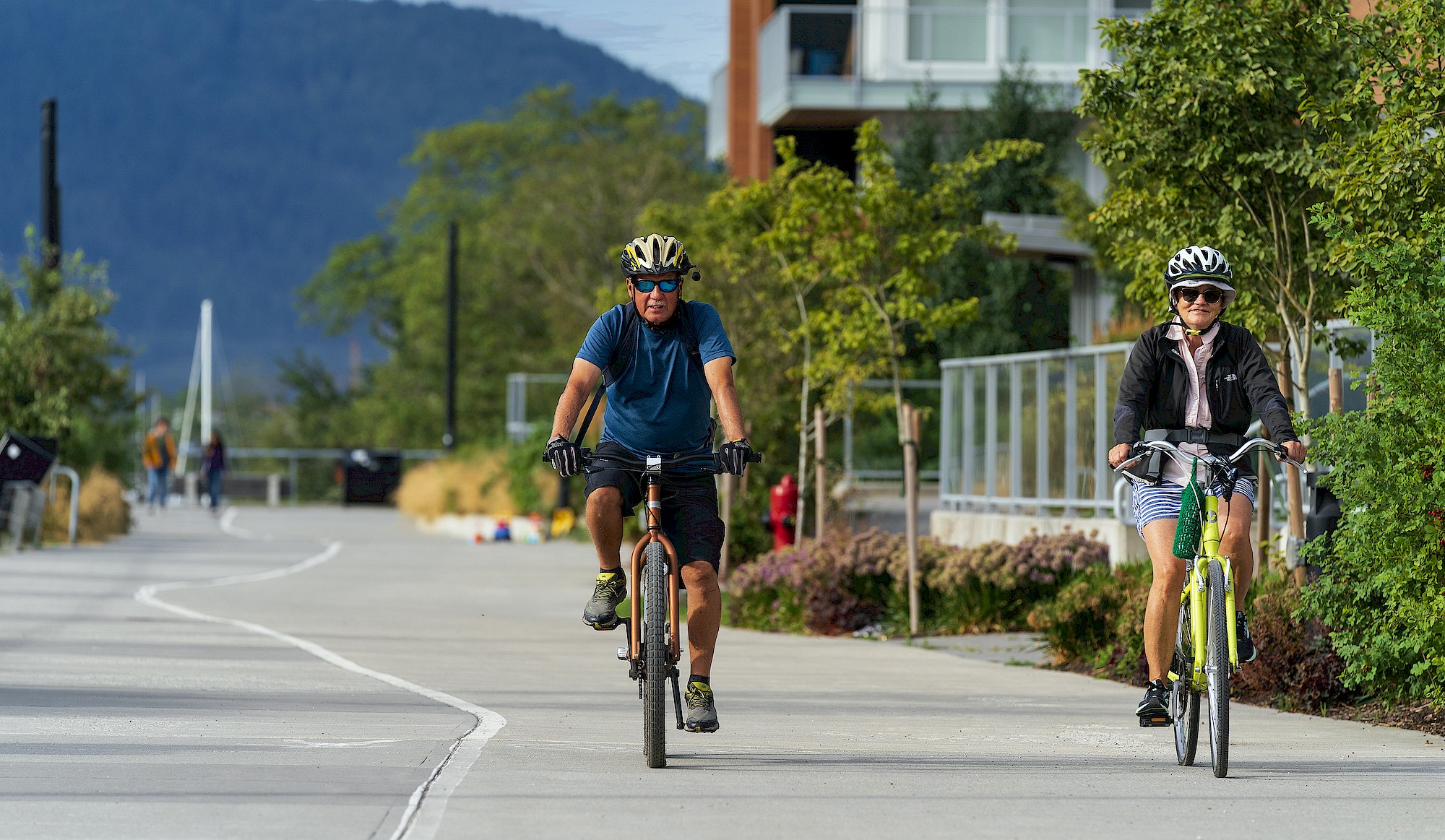 Older couple biking on the Corridor Trail in the Squamish Blind Channel