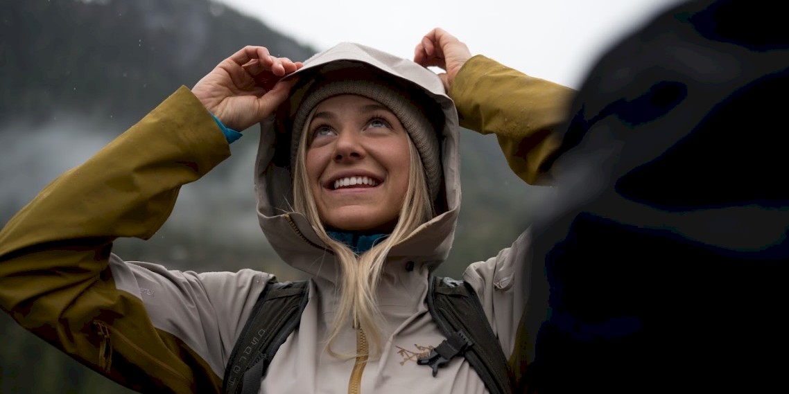 Couple on top of the mountain in the rain