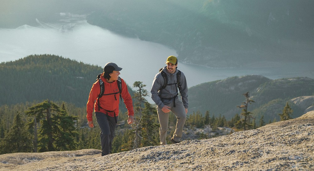 Two friends hiking in the fall sun