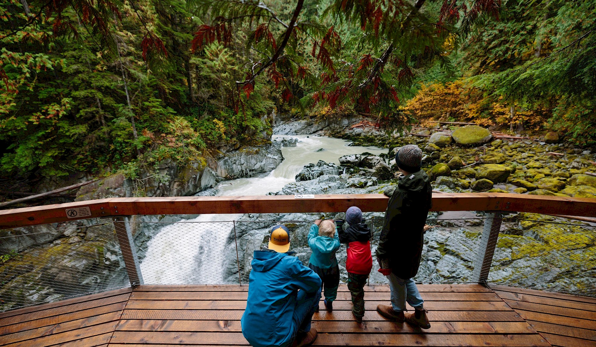 Family looking over the Mamquam Falls at Squamish Canyon