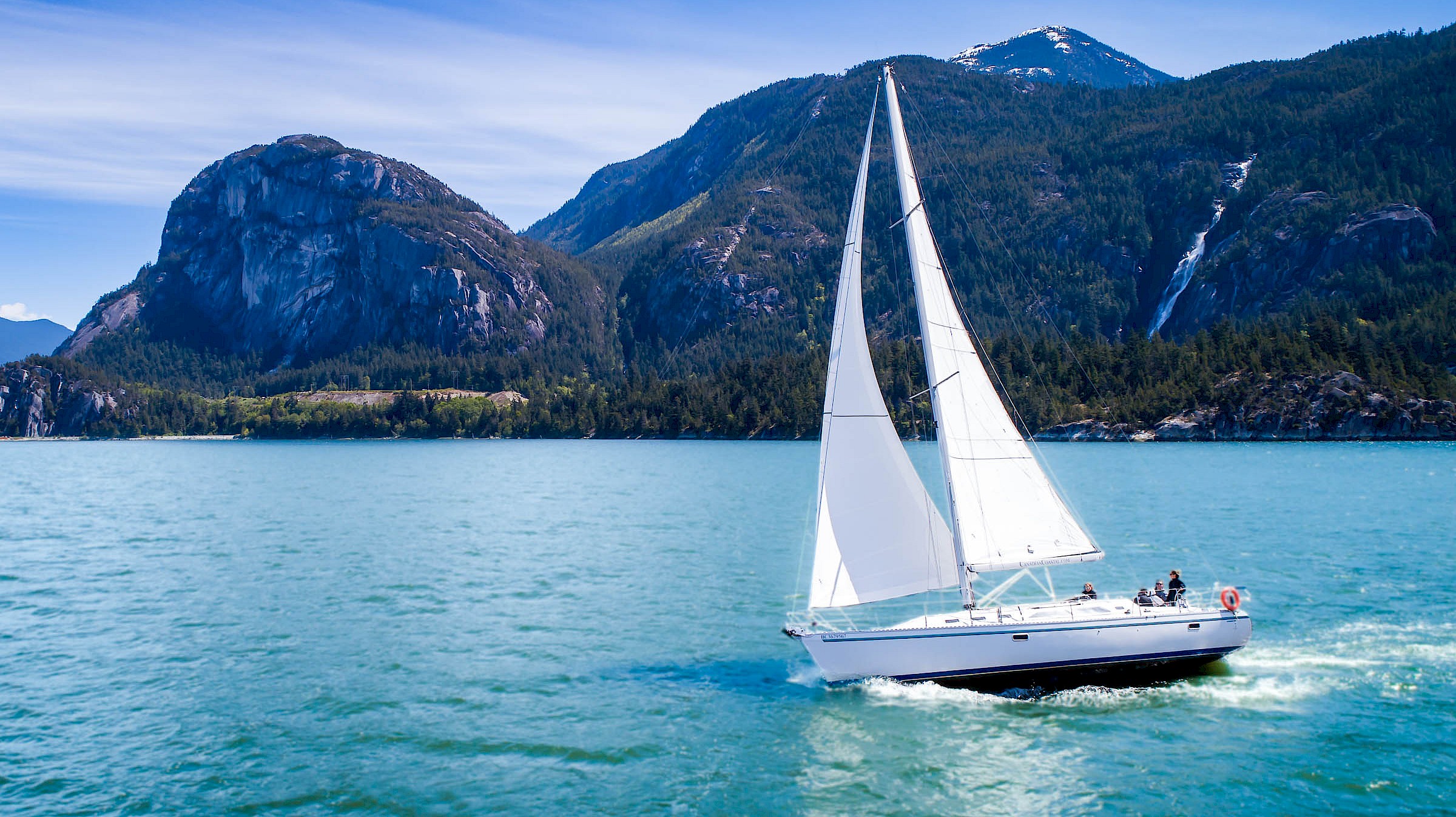 Sailboat with backdrop of the Squamish Chief and Shannon Falls