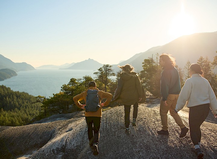 Group of friends hiking and overviewing the Howe Sound