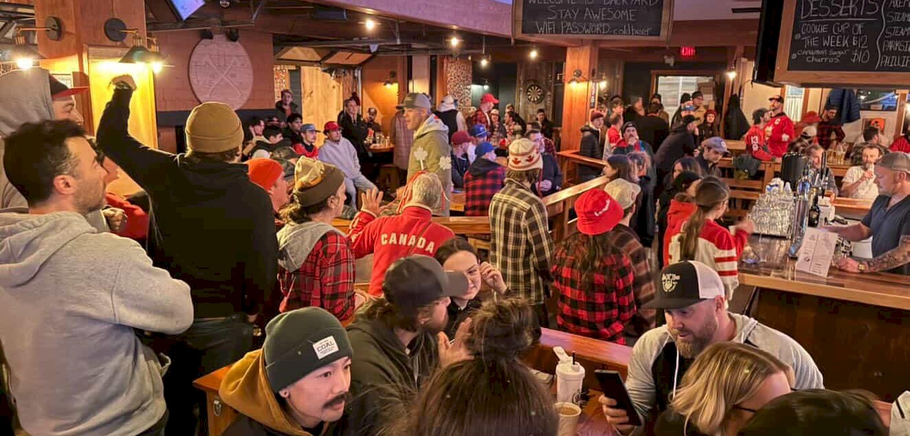 Fans watching the game at the Backyard