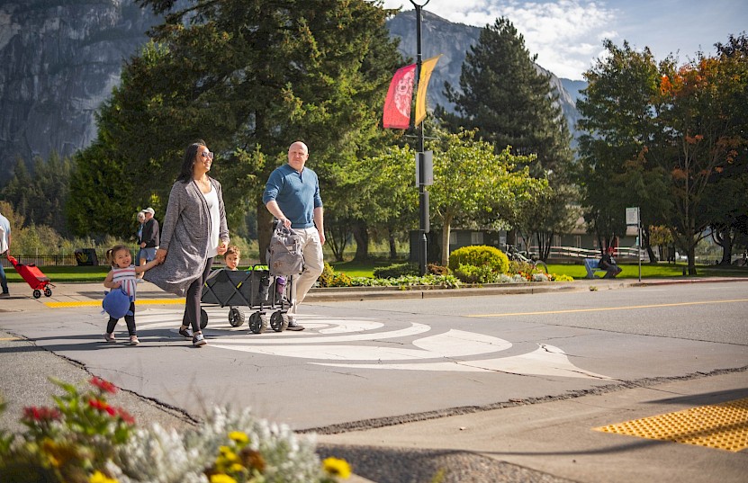 Family walking on crosswalk in Downtown Squamish